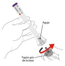 Urządzenie do samowstrzykiwania z igłą włożoną w skórę, czerwona strzałka wskazuje obrót szarego korka na podstawie