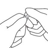 Hands holding a self-administered injection device with exposed needle