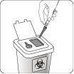 Needle and syringe being disposed of in a white container with a visible biological hazard symbol on the front