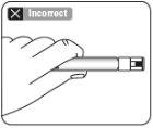 Hand holding a syringe with the needle pointing downwards incorrectly without proper angle