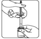 Hand holding a syringe with the needle inserted into a transparent vial of liquid medication