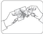 Hands holding and separating two medication blister packs with a circular device in the right hand