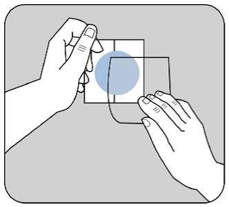 Hand applying a square, transparent medicinal patch to the skin with another hand holding the edge