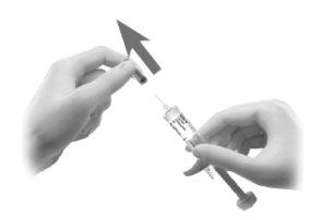 Hand holding syringe with needle pointing down and another hand holding the syringe body