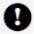 White exclamation mark centered within a solid black circle warning of caution