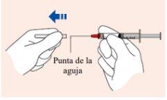 Hands holding a syringe with a transparent needle pointing downward with blue arrow indicating direction and text
