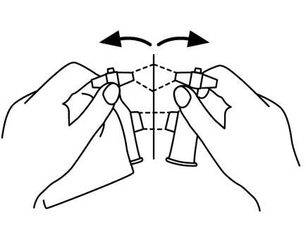 Due mani che tengono e ruotano un dispositivo medico con due cilindri e frecce curve che indicano la rotazione