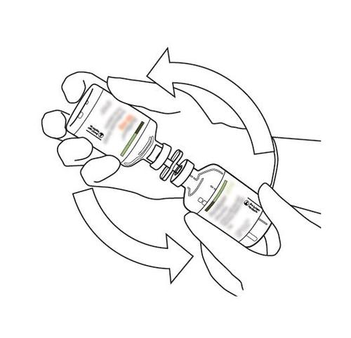 Mano che ruota un cilindro di plastica trasparente con una fiala di vetro all