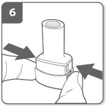 Dispositivo autoiniettante con due frecce nere che indicano la pressione sulle ali laterali per l