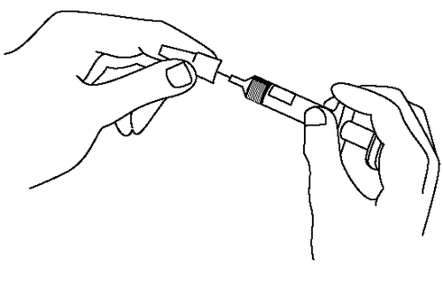 Mano che tiene una siringa collegata ad un ago, preparazione all