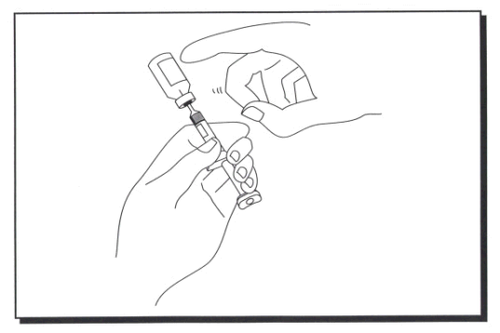 Mano che tiene una siringa pre-riempita con ago collegato e un adattatore per l