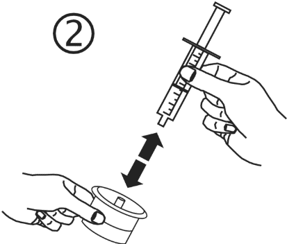 Mano che tiene una siringa pronta per l