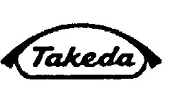 Logo Takeda stilizzato in nero su sfondo bianco forma ovale appuntita con scritta corsiva all