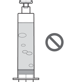 Siringa trasparente con liquido e bolle d