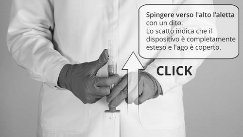 Mano con guanto che tiene una siringa e preme l