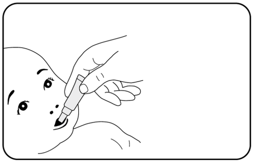 Mano che applica una goccia di collirio nell