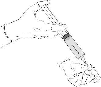 Mano che tiene una siringa pronta per l