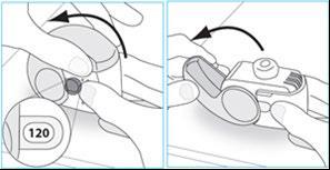 Dispositivo autoiniettante con cartuccia inserita e pulsante di rilascio premuto per l