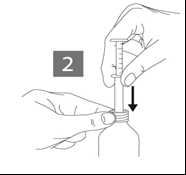 Mano che afferra una siringa mentre l