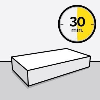 Orologio con numeri neri e sfondo grigio che indica le 30 minuti con la met&agrave; del cerchio gialla sopra una confezione bianca rettangolare