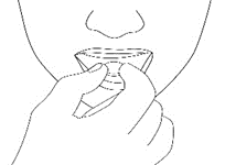 Mano che tiene e inclina un ovulo vaginale, con la punta rivolta verso l