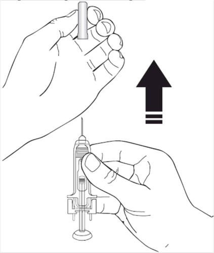 Mano che tiene una siringa pronta per l