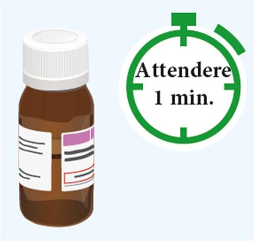 Fiala marrone con etichetta bianca e tappo a vite accanto a un orologio verde con la scritta