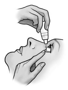 Mano che tiene un flacone contagocce mentre una goccia viene instillata nell