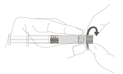 Mano che ruota un cilindro grigio con scanalature su un ago di siringa per il fissaggio