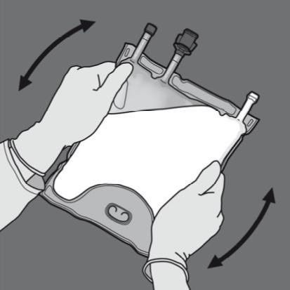 Mani con guanti che tengono e ruotano un dispositivo medico trasparente con tubi e connettori bianchi e neri