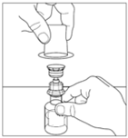 Fiala di vetro con tappo e protezione rimossi tenuta da una mano mentre un