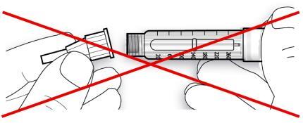 Penna iniettabile con ago collegato sbarrata da una croce rossa su mano che la tiene