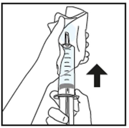 Mano che tiene una siringa preriempita con l