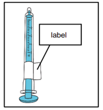 Siringa trasparente con liquido blu graduato e pistone bianco un