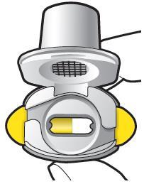 Dispositivo inalatorio con serbatoio grigio e bocchino giallo, contenente una capsula gialla all