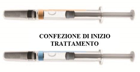 Due siringhe pre-riempite con soluzioni colorate arancione e blu sono mostrate sopra il testo