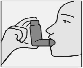 Mano che tiene un inalatore vicino alla bocca chiusa di una persona, dimostrando l