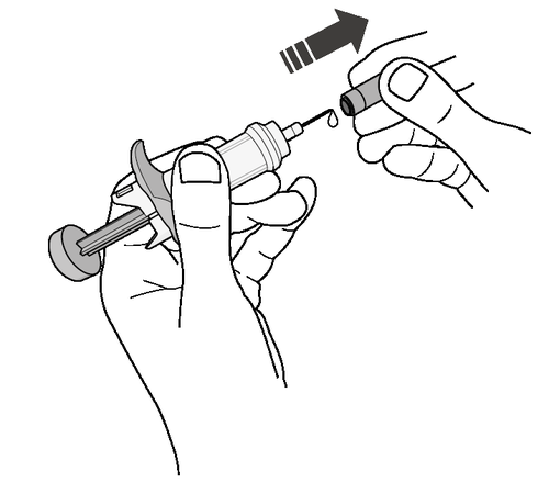 Mano che tiene una siringa pronta per l