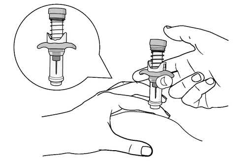 Mano che tiene un dispositivo medico con stantuffo a molla e connettore, dettaglio ingrandito in bolla mostra sezione interna