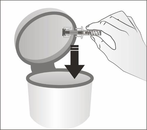 Fiala di vetro con stantuffo e ago, tenuta da una mano che la spinge verso il basso in un contenitore cilindrico grigio