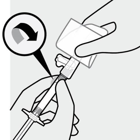 Mano che afferra una siringa preriempita con ago protetto, freccia curva indica la rotazione del dispositivo per la preparazione