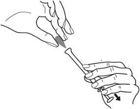 Mano che tiene una siringa preriempita e l