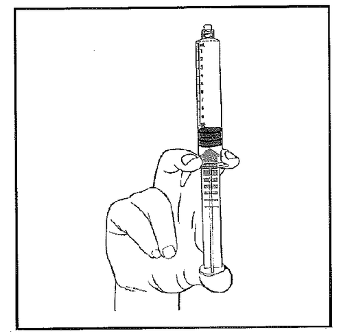 Mano che tiene una siringa graduata con ago inserito nella pelle per iniezione sottocutanea o intramuscolare