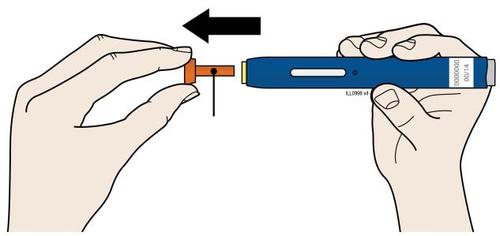 Mani che tengono un dispositivo per iniezione con ago e cartuccia arancione preparati per l