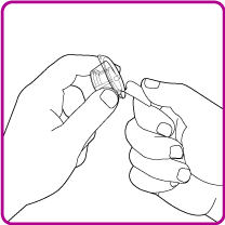 Mani che tengono e ruotano un dispositivo penna iniettabile con un ago visibile per l