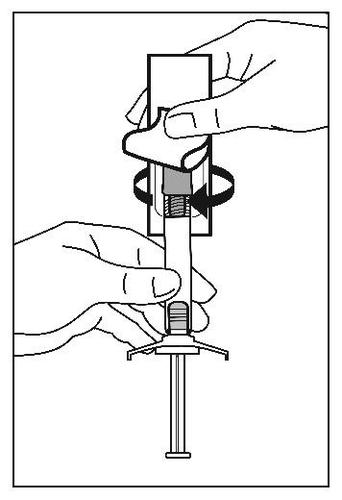 Mano che tiene una siringa preriempita con ago protetto e meccanismo di sicurezza attivabile con rotazione