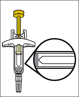 Dispositivo autoiniettante giallo e grigio con ago visibile e ingrandimento circolare del meccanismo di iniezione