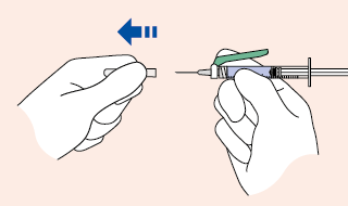 Mano che tiene la siringa pronta per l