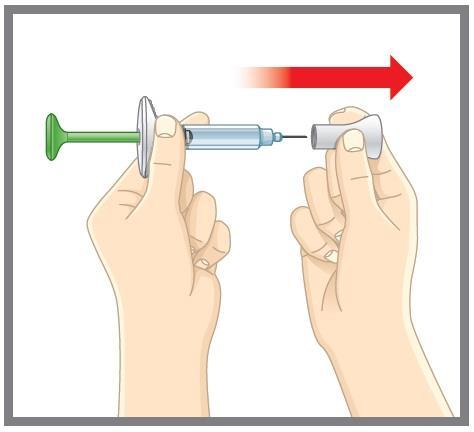 Mani che assemblano un dispositivo medico a siringa con ago protetto da cappuccio trasparente e stantuffo verde freccia rossa indica il movimento
