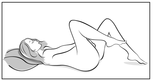 Paziente sdraiata su un fianco con le ginocchia piegate e sollevate verso il petto e la testa appoggiata su un cuscino
